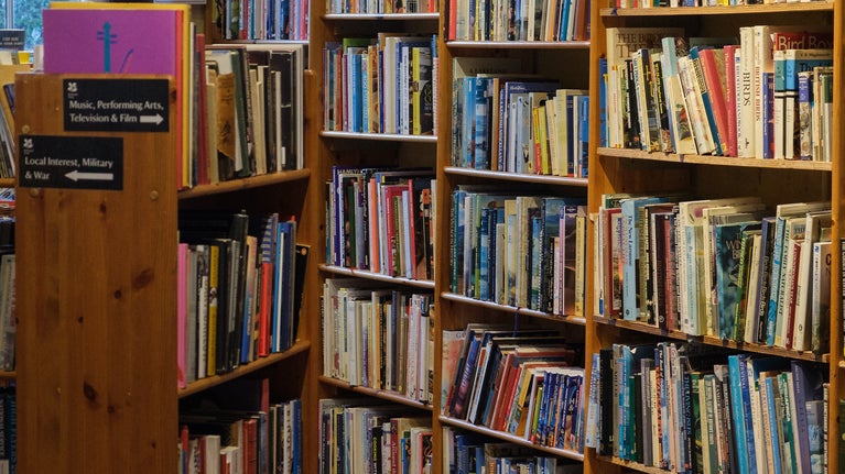 Shelves lined with second-hand books at Wimpole Estate